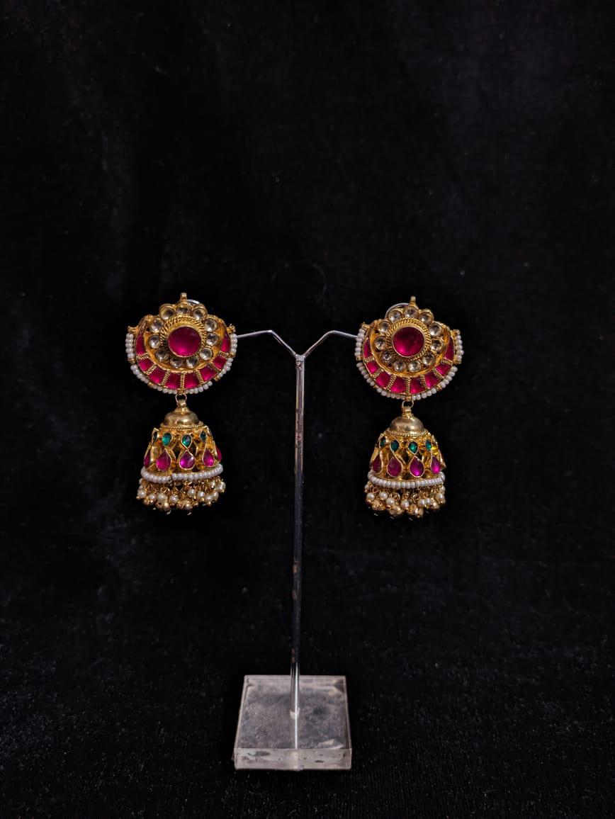 "Kundan Jhumkas with Pink and Green Accents"